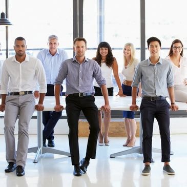 Diverse business team standing together in office